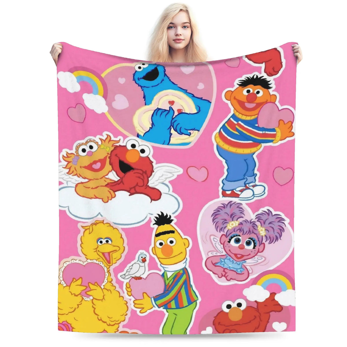 A pink flannel throw blanket featuring characters from Sesame Street and Friends