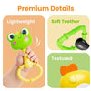 A hand holds a bright green silicone baby animal rattle teether toy with a yellow ring, shown next to details about its light