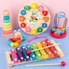 A set of wooden puzzles and stacking toys including a large circular puzzle, stacking rings, and wooden puzzles for toddlers.