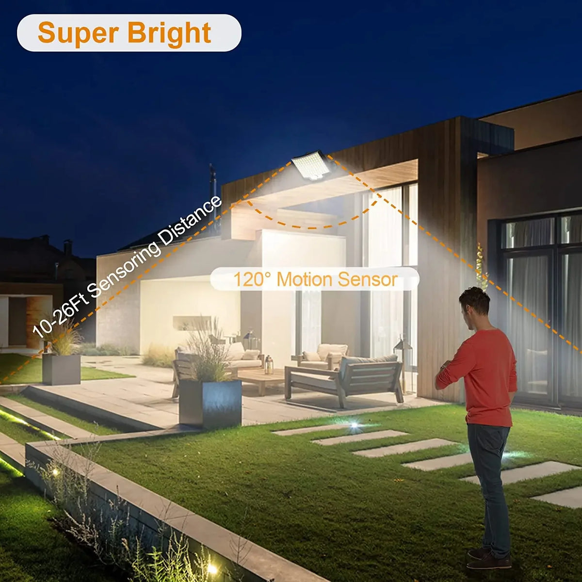 A bright outdoor flood light illuminates a garden area at night, demonstrating the 10-26ft sensing distance.