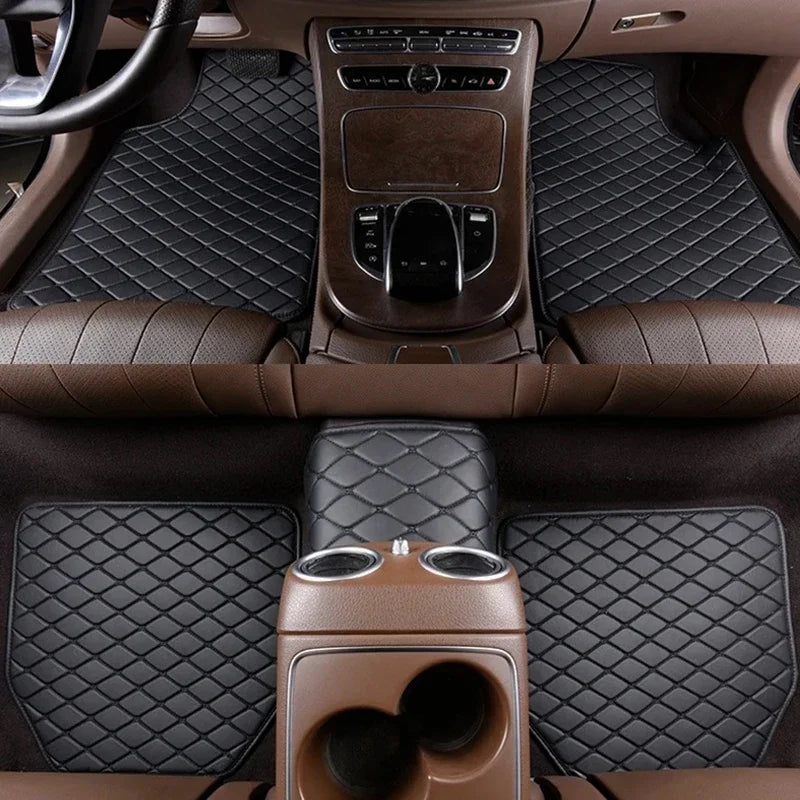 Interior view of a car with premium brown quilted leather floor mats and steering wheel.