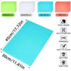 A set of four colored EVA refrigerator shelf liners including green, white, blue, and red mats, with a large cyan mat shown b