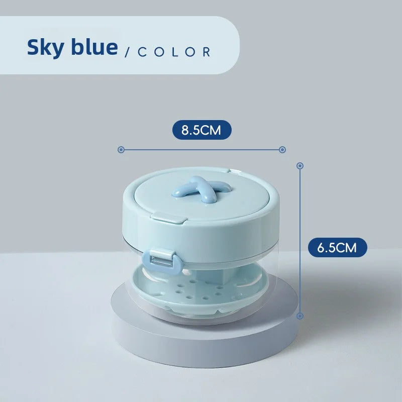A light blue portable retainer and denture cleaning case with an effervescent tablet dispenser.
