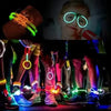 A child wearing bright bendable glow bracelets and glasses, with other glowing accessories visible.