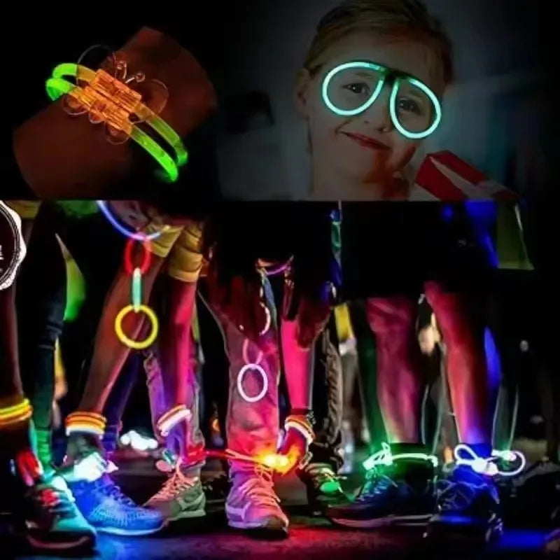 A child wearing bright bendable glow bracelets and glasses, with other glowing accessories visible.