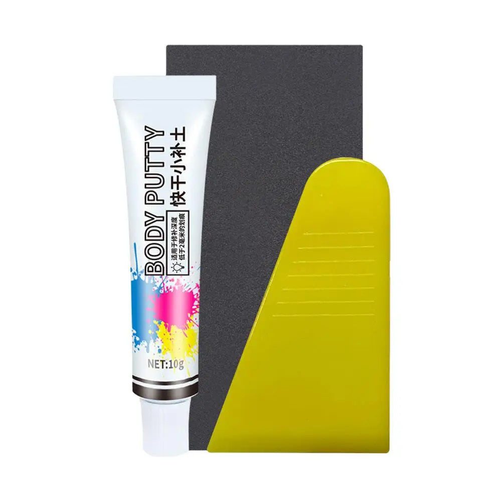 Tube of Body Putty in a white container next to a yellow rectangular object.