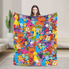 A colorful flannel throw blanket featuring characters from Sesame Street and Friends