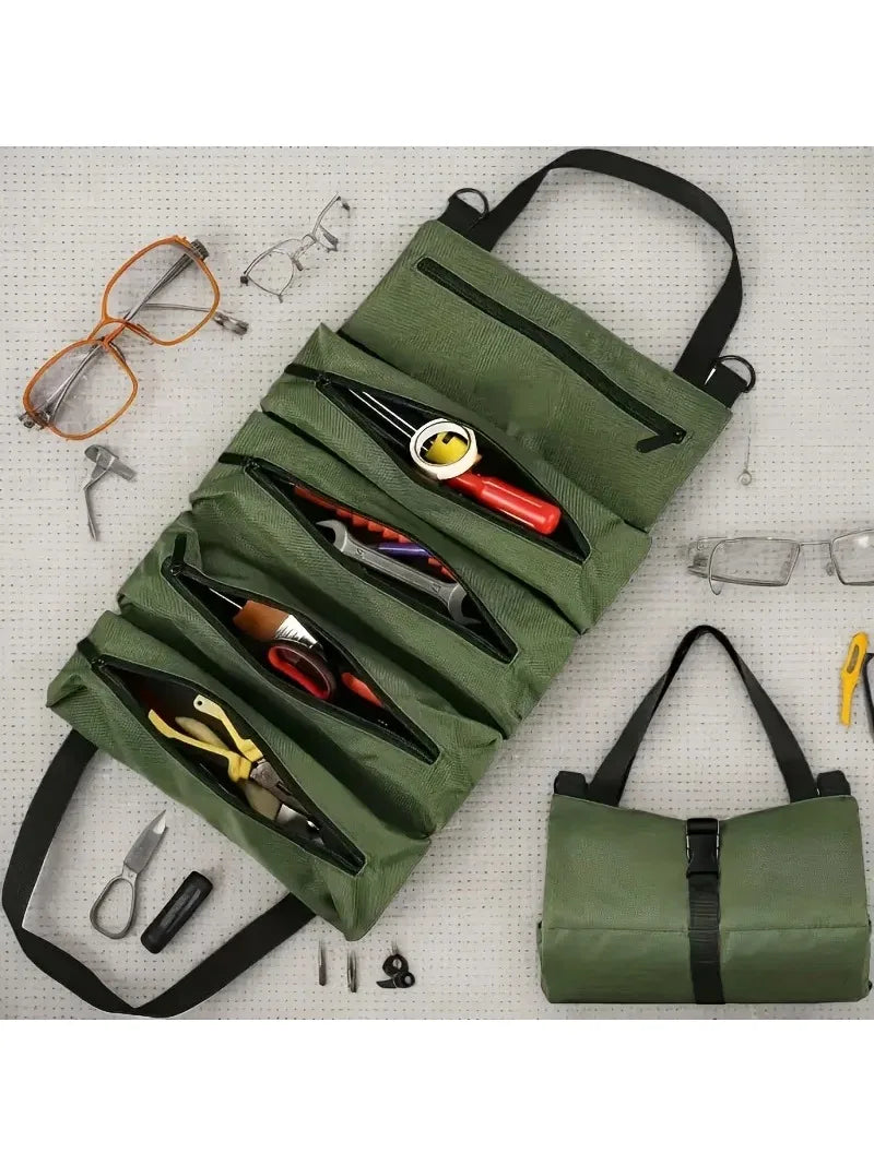 A dark olive green roll-up multi-pocket tool organizer bag filled with various small tools and glasses.