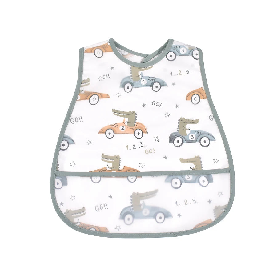 A white baby feeding bib featuring a gray and blue vehicle pattern with catch pockets.