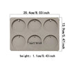 A rectangular silicone mold with six circular cavities for making soap or aromatherapy discs.