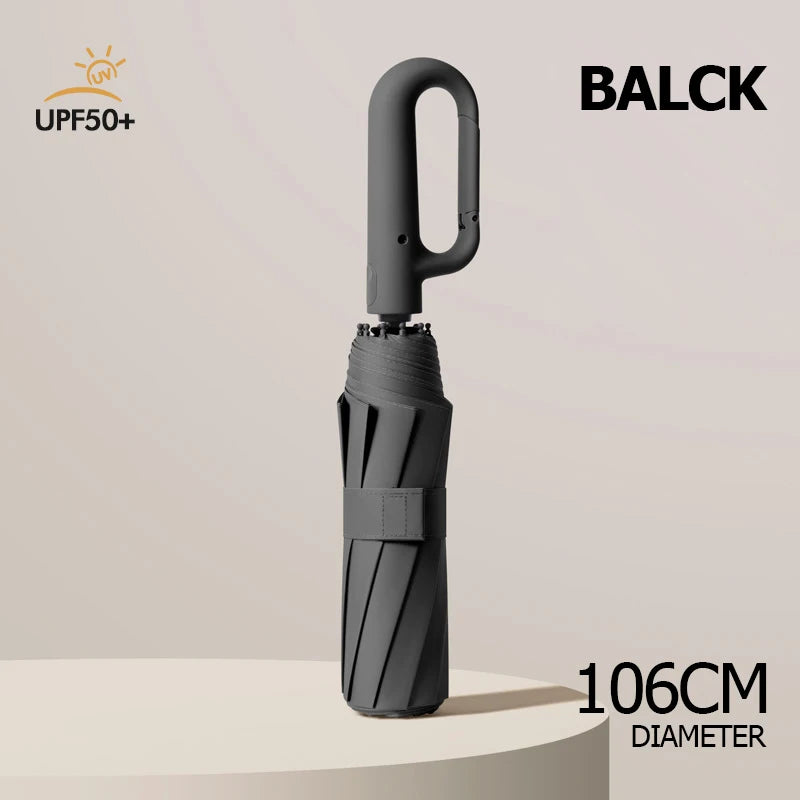 A black windproof reverse folding umbrella with a carabiner handle and reflective stripe, shown vertically.