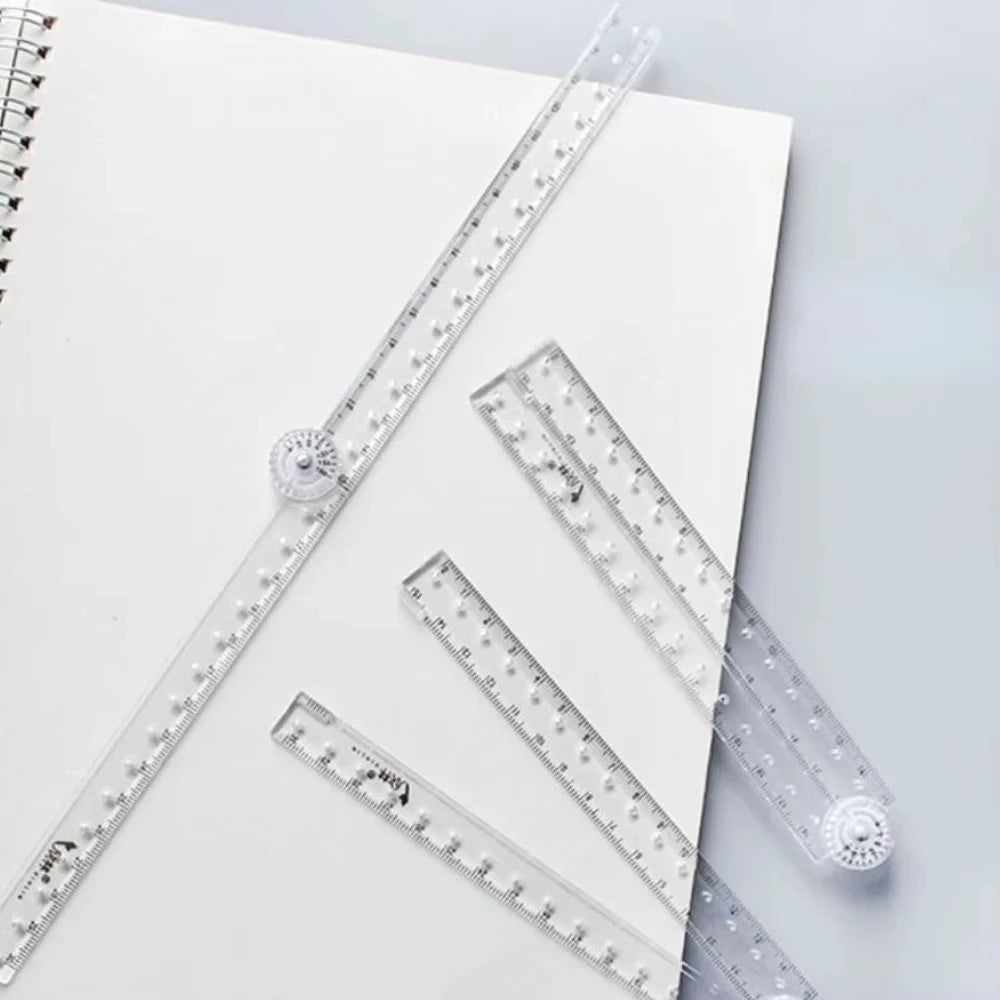 A transparent foldable plastic ruler with millimeter markings is shown on a white background.
