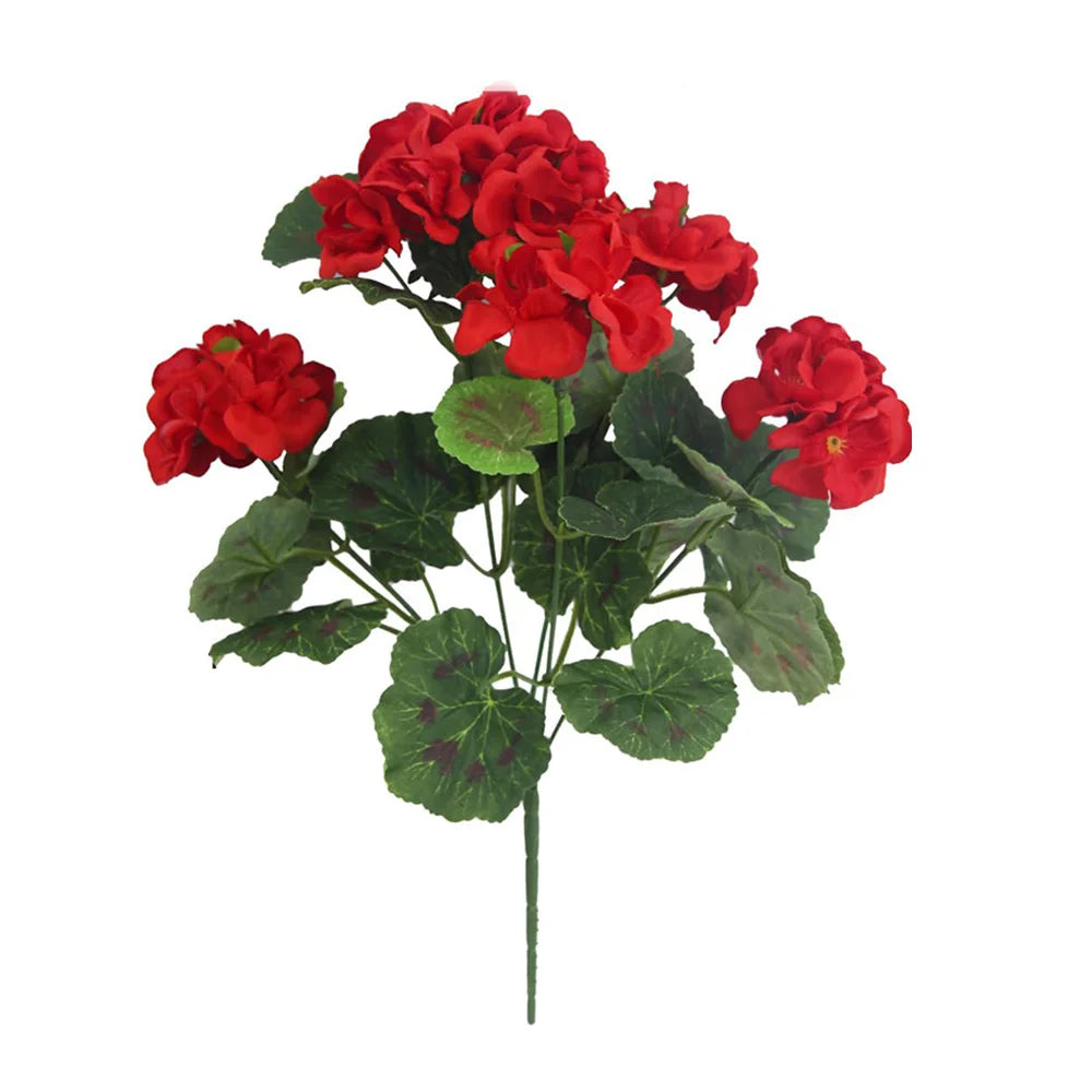 A bouquet of red artificial geranium flowers with green leaves.