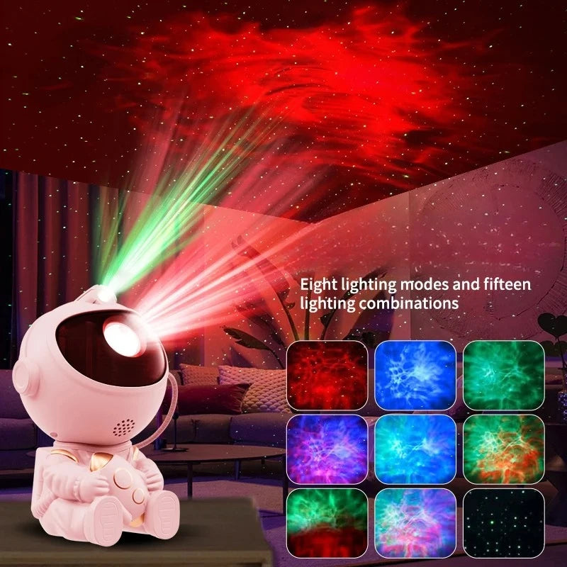 A pink astronaut night light projector casting red and green light beams onto a room.