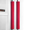 A pair of red fabric covers for refrigerator handles, hanging on a metal rod.
