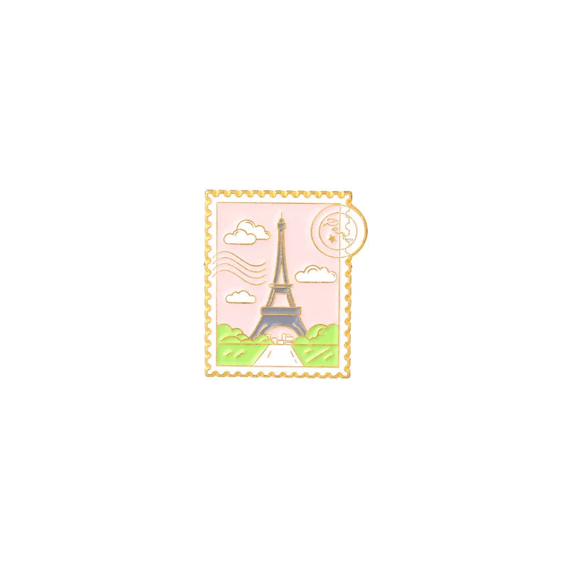 Vintage airline ticket enamel brooch set featuring the Eiffel Tower and a moon in a pink frame.