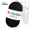 Black soft T-shirt yarn for crochet and knitting used in a craft context.