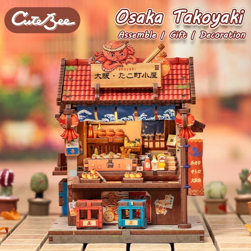 A detailed miniature food stall display of Osaka Takoyaki in a wooden box with lighting and decoration.