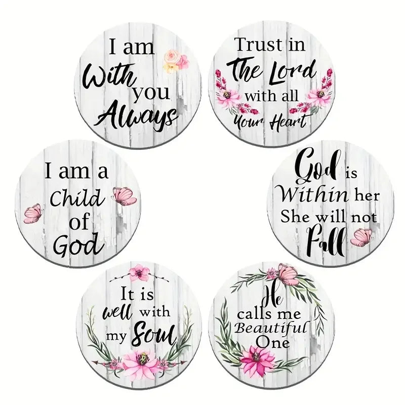 A set of six round wooden coasters featuring hand-painted English religious phrases like I am with you Always and Trust in th