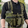 A hand-mounted work glove clip with a carabiner attached to a tactical vest and paracord lanyard.