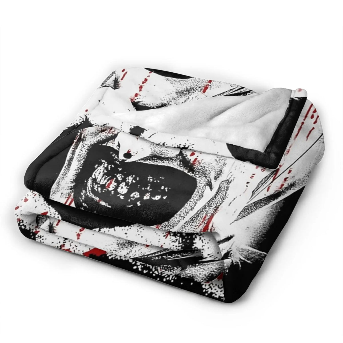 A black and white vintage art the clown coral fleece throw blanket folded and displayed.