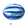 A ball of extra thick blue and white chenille yarn with horizontal stripes.
