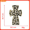 Iron-on patch featuring a black and yellow leopard print cross design