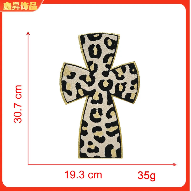 Iron-on patch featuring a black and yellow leopard print cross design