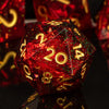 A red polyhedral die with gold numbers is displayed on a dark surface.