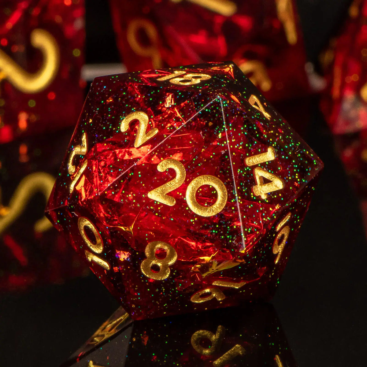 A red polyhedral die with gold numbers is displayed on a dark surface.