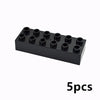 A black set of five large building blocks or connectors arranged in a row.