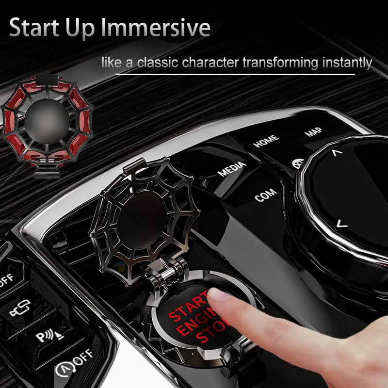 A hand presses a red button on a black ignition cover, demonstrating the start-up immersive feature.