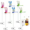 A collection of lifelike dragonfly garden decor clips in various colors and sizes hanging from thin wires.