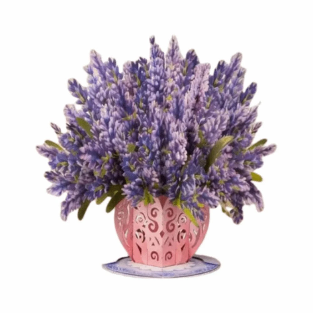 A bouquet of purple lavender flowers in a pink vase on a white background.