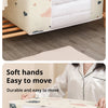 A beige foldable blanket and clothes storage bag with a sturdy zipper shown in an open view.