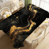 Black gold marble waterproof tablecloth displayed on a table with white chairs.