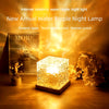 A glowing, textured glass night lamp emitting a warm yellow light on a wooden surface.