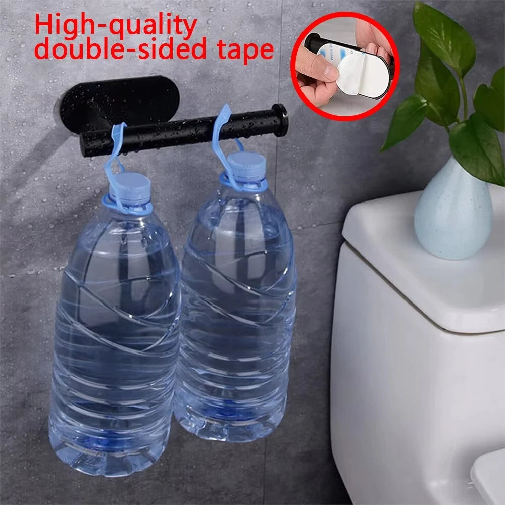 Two clear plastic bottles of water mounted using high-quality double-sided tape on a bathroom surface.