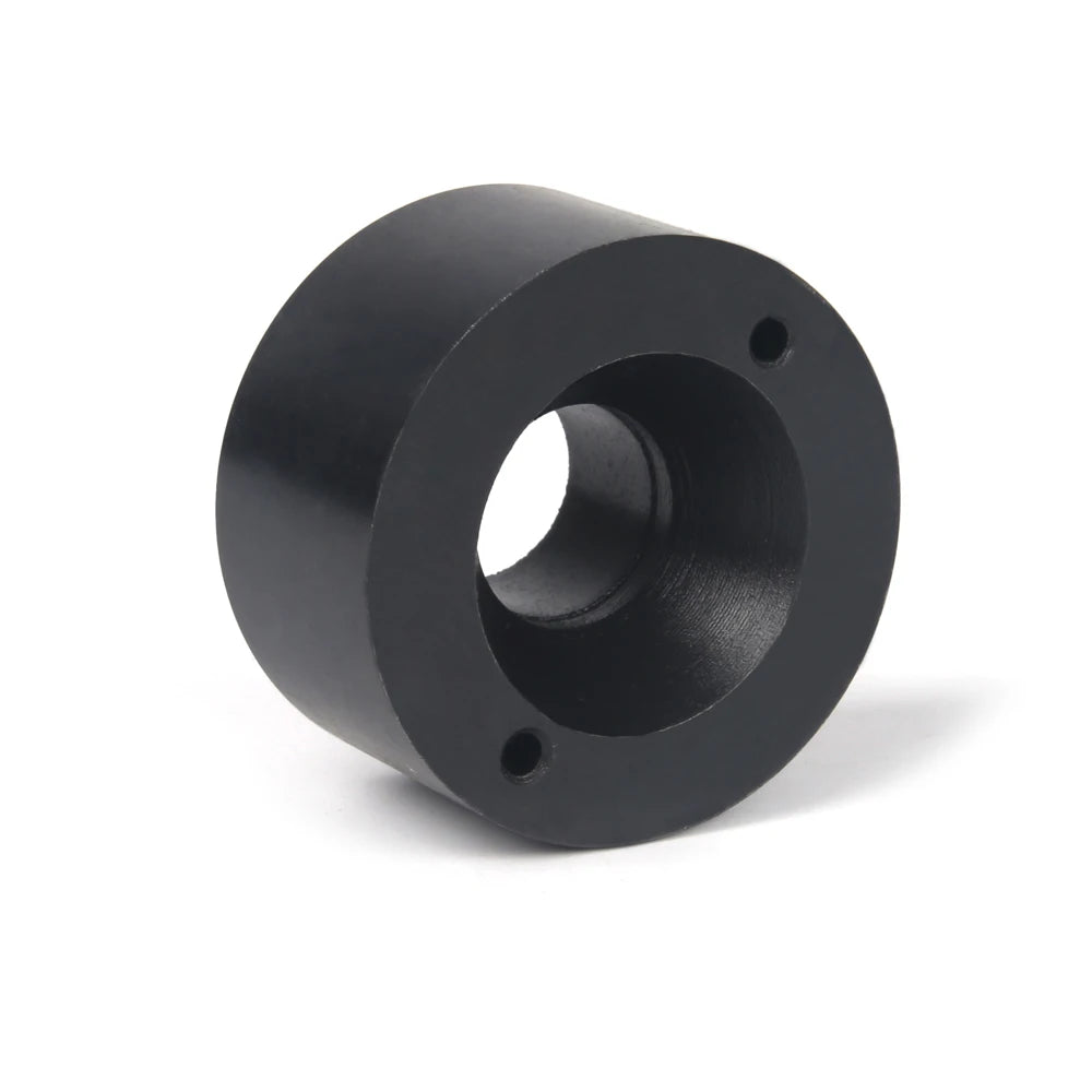 A black universal wheel stud installer tool with a cylindrical body and mounting holes.