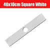 A white square diatomite mat with parallel grooves and a hole, used as a quick-dry faucet mat.