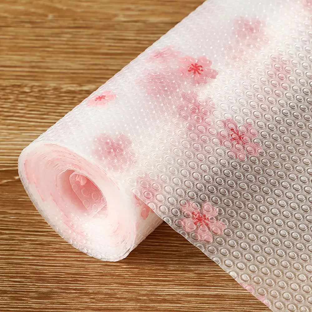 Roll of pink waterproof cabinet and drawer liner with floral patterns