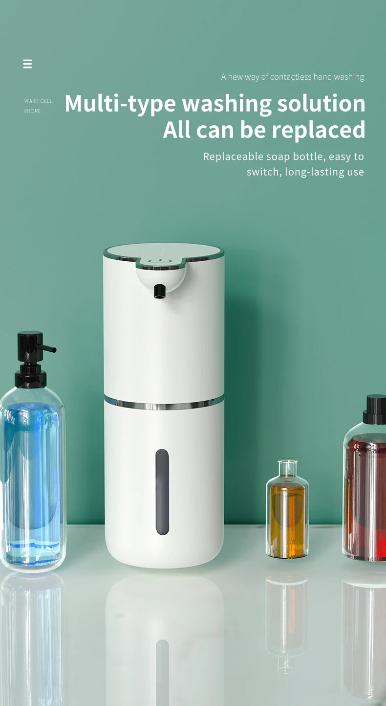 A white touchless automatic soap dispenser with a black pump and an interchangeable replaceable soap bottle on a glass surfac