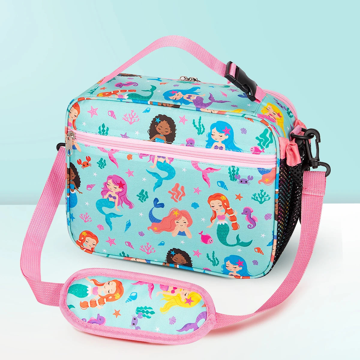 A pink insulated lunch bag featuring a colorful mermaid design with an adjustable shoulder strap.