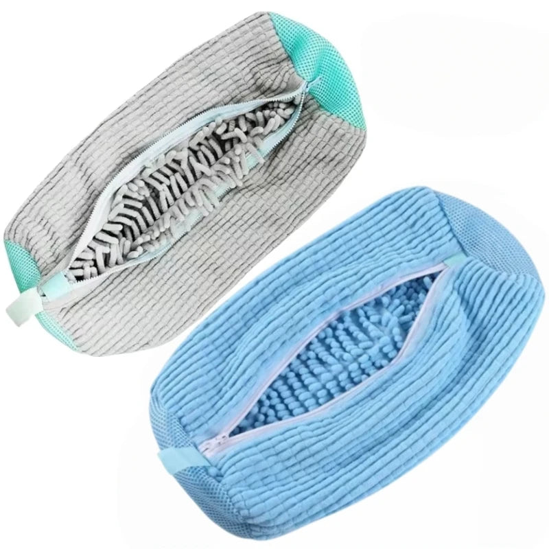 A light gray and blue shoe washing machine bag with a soft bristled cleaning brush set.