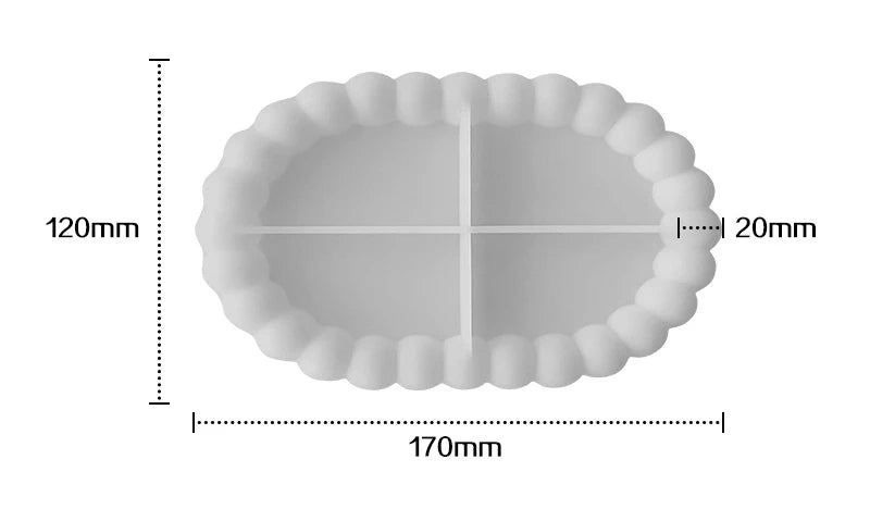 A white silicone tray mold with a ruffled edge and a cross-shaped depression for crafting materials.