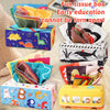 A colorful tissue box filled with crinkle scarves and various baby toys for early education.