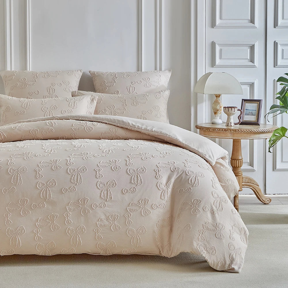 A beige Nordic leaf print duvet cover set displayed on a bed with white upholstered headboard and decorative molding.