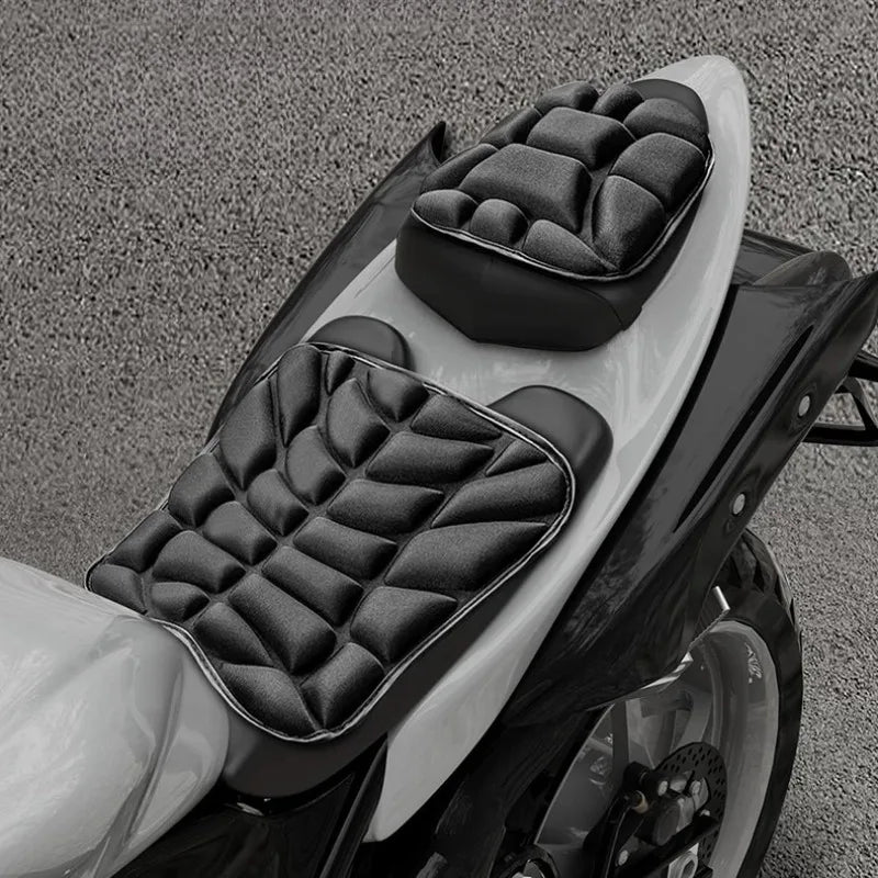 A close-up view of an ergonomic 3D motorcycle seat cushion made of black and white breathable EVA foam.