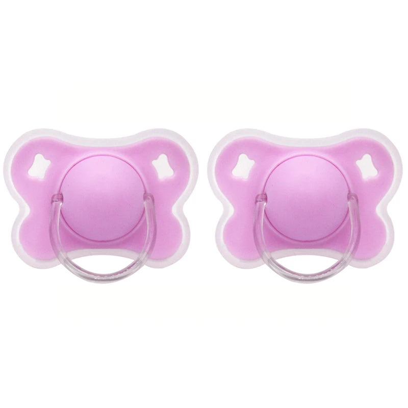 A pair of pink silicone baby pacifiers with a flower design and protective cover.