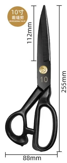 A pair of black professional heavy-duty fabric shears with a gold-colored marking and measurement scale.